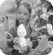 Image of a child at school holding a plush teddy of Rose. One of the many storybook characters from the myHappymind mental health and wellbeing program.